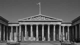 The neoclassical facade of the British Museum in London