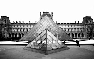 The Louvre Pyramid and palace courtyard in Paris